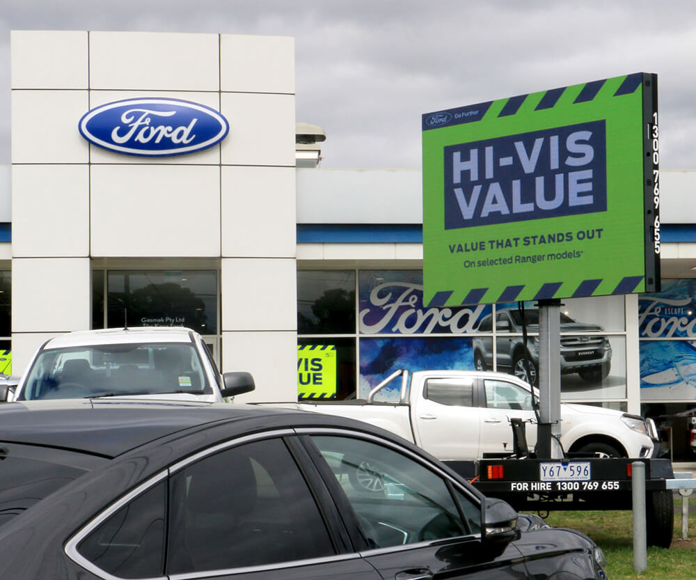 LED trailer advertising for a Ford dealership on a busy Melbourne road