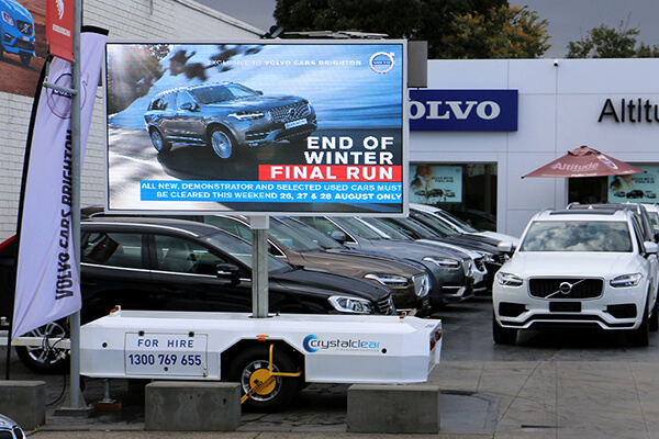 Mobile LED trailer displaying a bright advertisement on a Melbourne roadside
